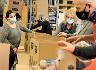 The Pokagon Band and Its Four Winds Casinos Donate 1,000 Easter Baskets to Those in Need Pokagon Band and its Four Winds Casinos Packing Easter Baskets 2 low res